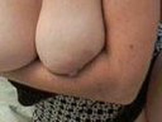 A older woman is obviously proud of those huge jugs of hers and rightfully so. Watch as that babe fondles and makes those large puppies sway.